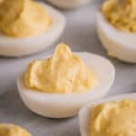 Creamy deviled eggs on a platter.