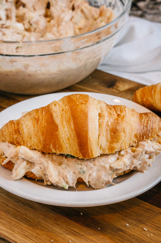 Light and delicious tuna salad in a fresh bakery croissant plated.
