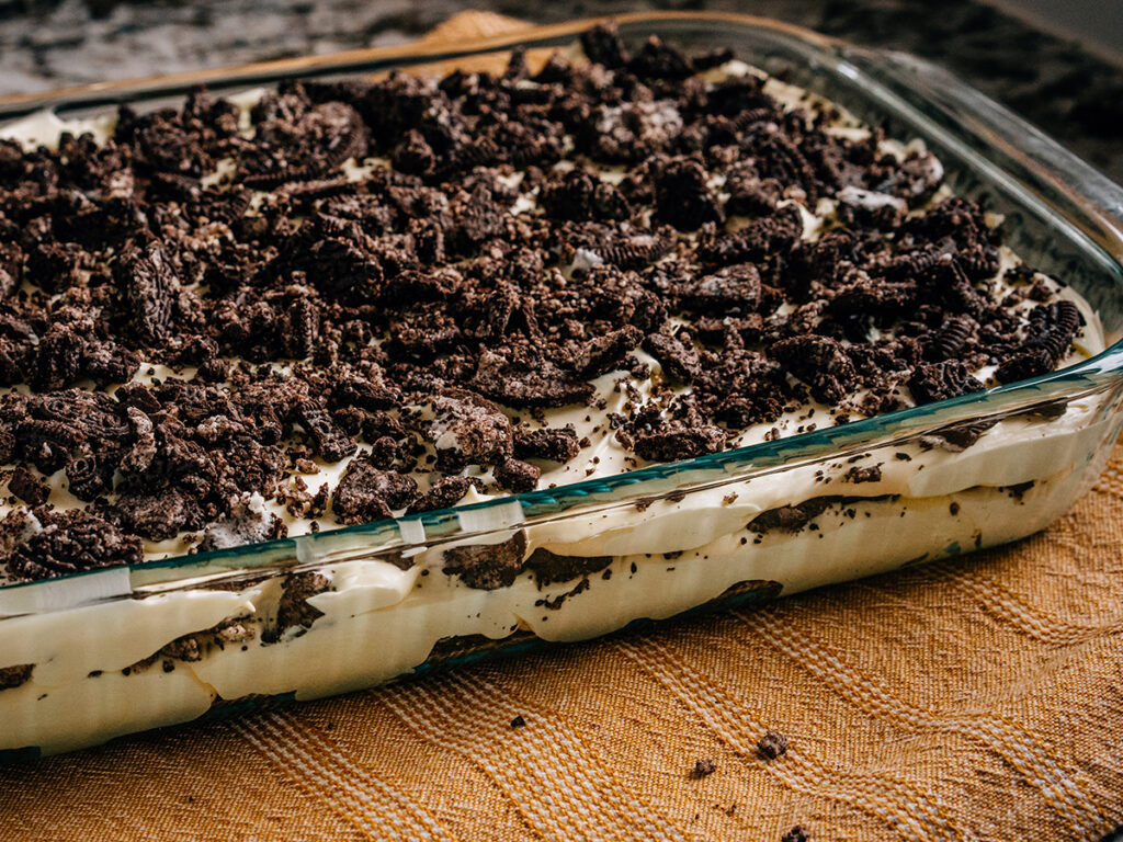 A side view of the pan of Oreo dirt pudding to show off the layers.