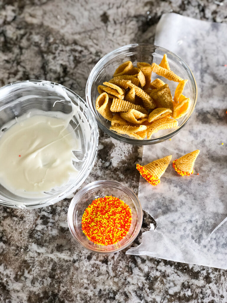 White chocolate, original Bugles and sprinkles to make witches' hats for the ultimate Halloween party mix.