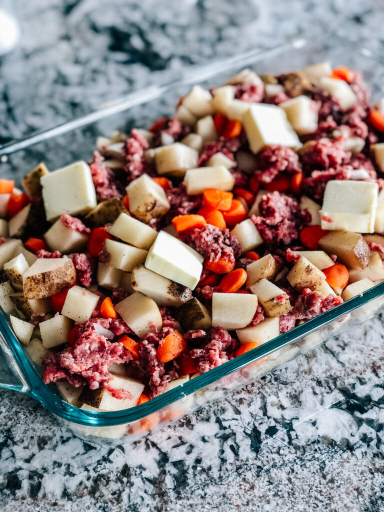 This ground hamburger and potato casserole all assembled and ready to be baked.
