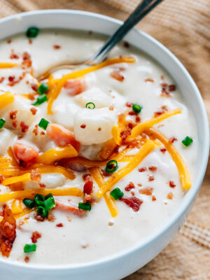 A bowl full of cream cheese potato soup ready to be eaten.