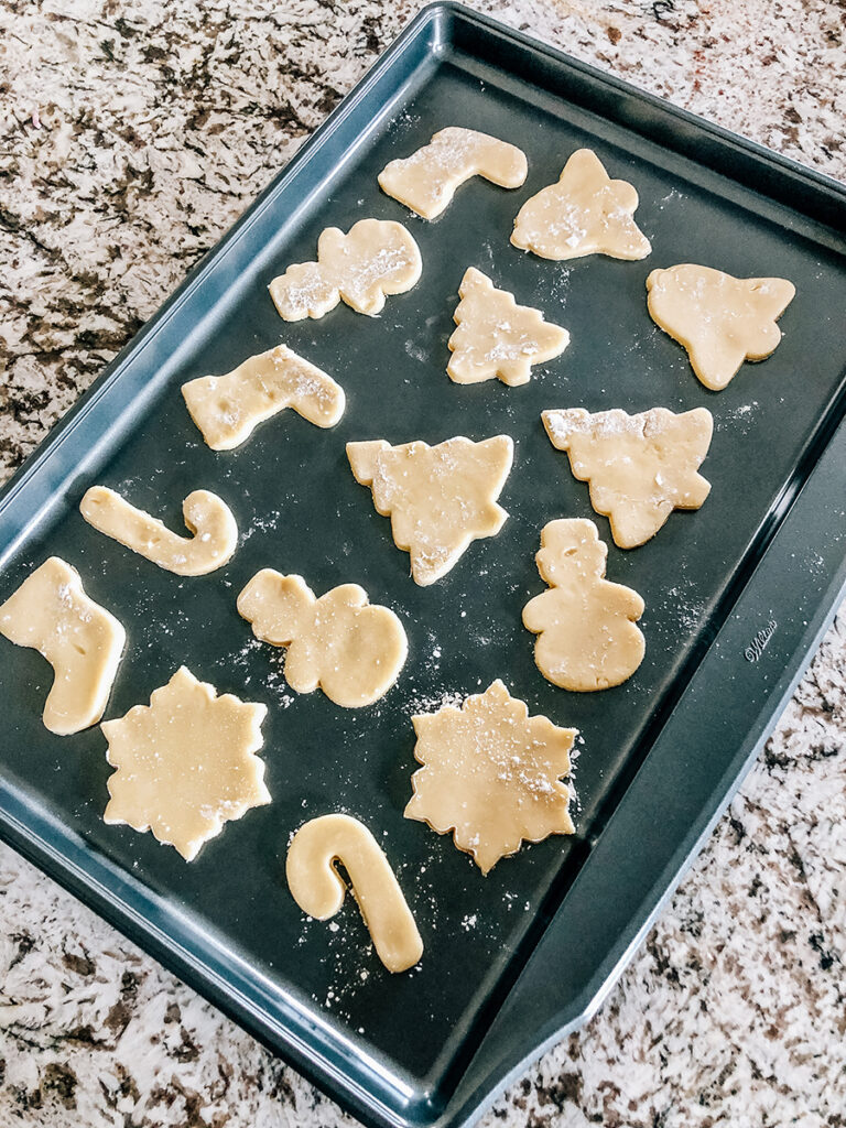 A baking sheet filled with raw sugar cookies ready to be baked!