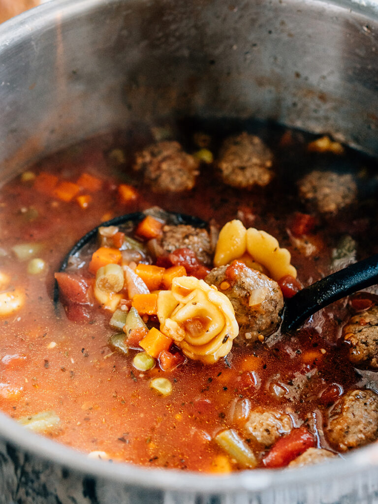 Finished easy Italian meatball and cheese tortellini soup in a stockpot