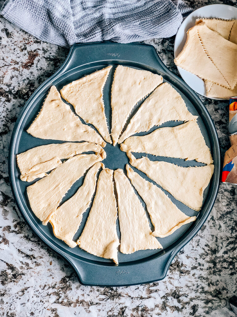 12 crescent rolls laid out in a circular pattern.