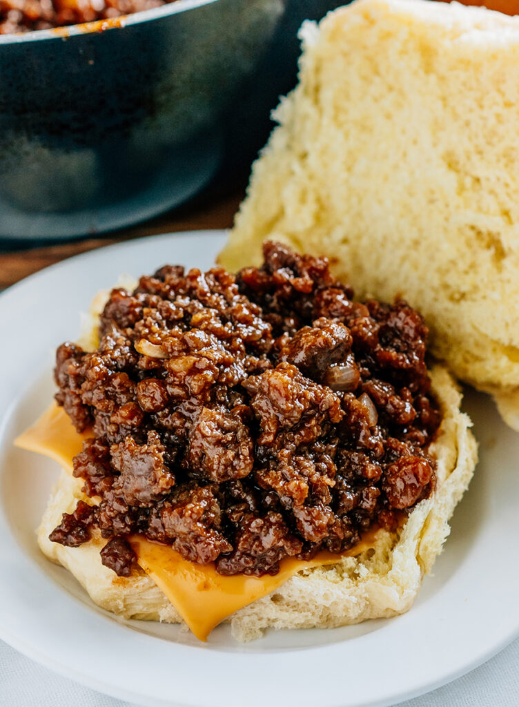 Easy sloppy joes on a slice of cheese and bun bottom.