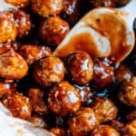 Meatballs stirred in a barbecue sauce, honey, minced garlic, and cayenne pepper cocktail sauce.