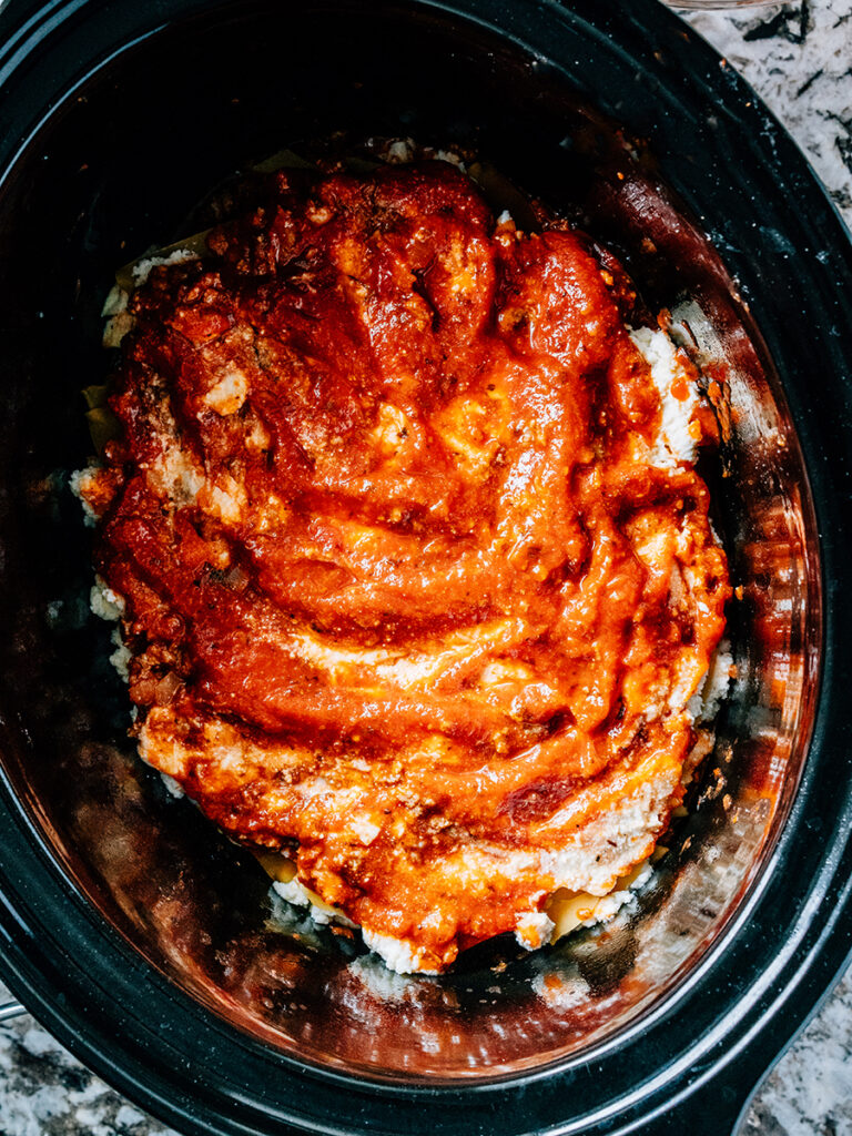Add the meat sauce once again to begin repeating the layer of this easy lasagna.
