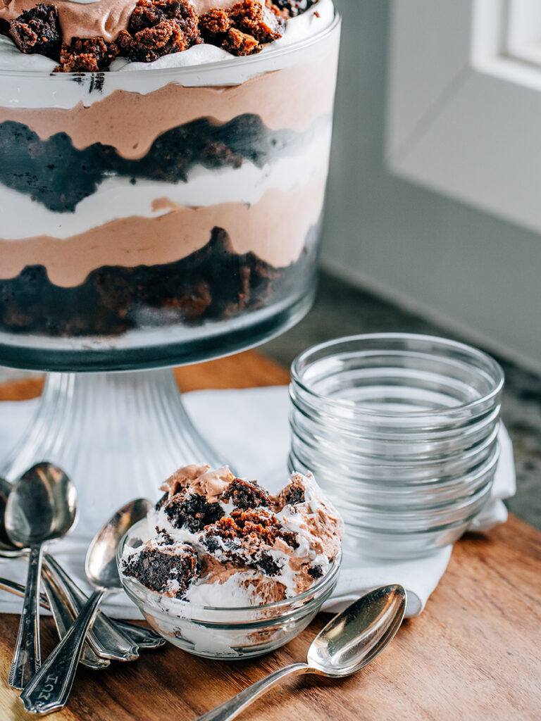 A serving of brownie trifle ina small dish.
