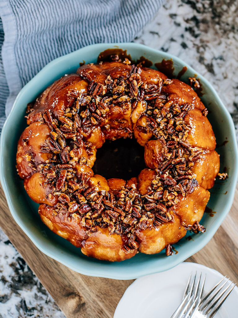 A yummy butterscotch coffee cake flipped from the bundt cake pan with caramelized pecans and a sweet butterscotch glaze on top!