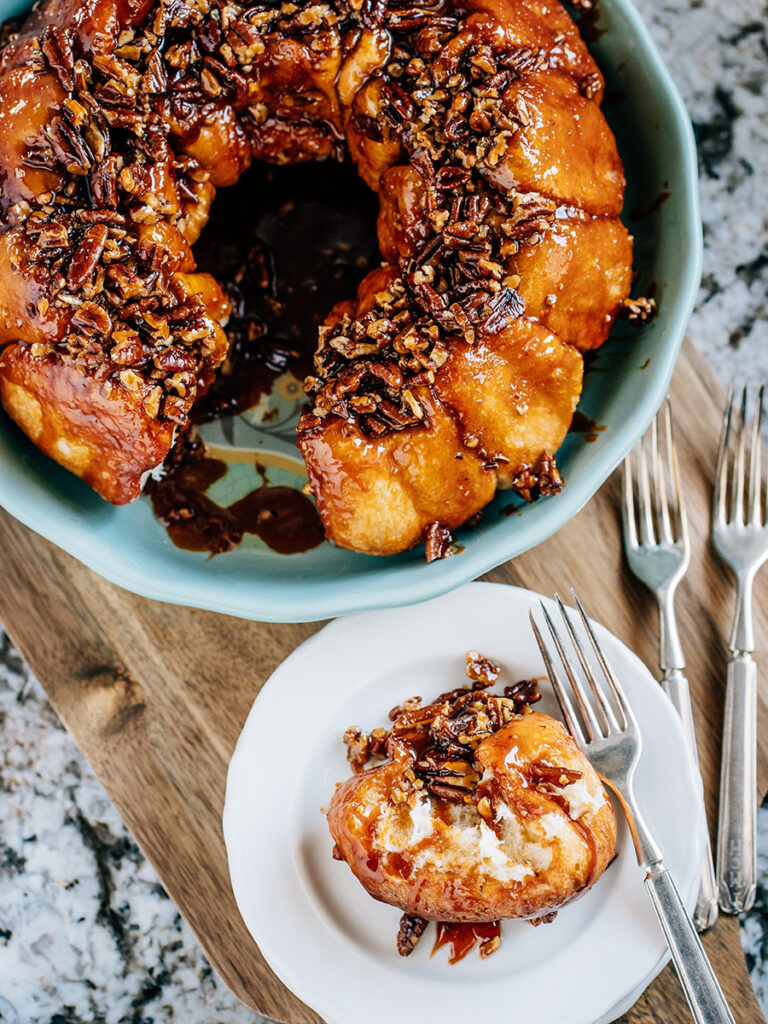A plate slice of caramelized pecans in a sugary butterscotch glaze over freshly baked frozen bread dough is this delicious Butterscotch Coffee Cake.