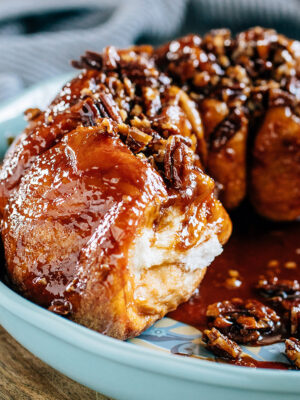 A delicious piece of flaky fresh bread topped with a brown sugar and butterscotch pudding glaze with caramelized pecans makes this subtle but sweet coffee cake!