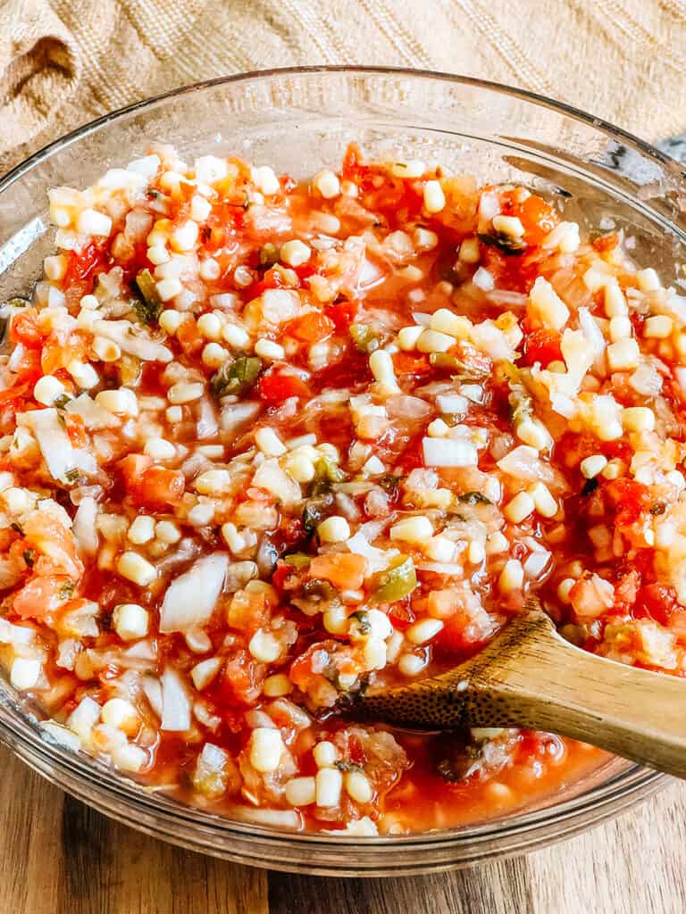 Crushed pineapple, shoepeg corn, chunky salsa, and chopped sweet onion stirred together to make this summer salsa.