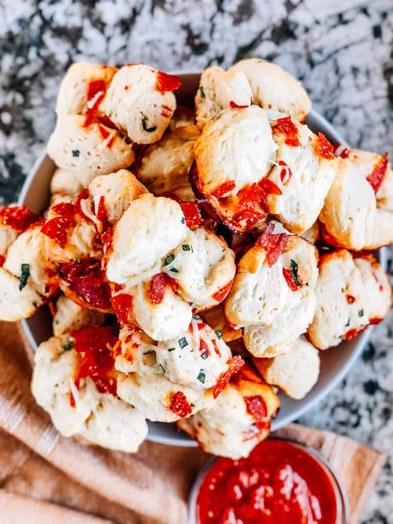 Overview shot of these easy pizza muffins on a pile.