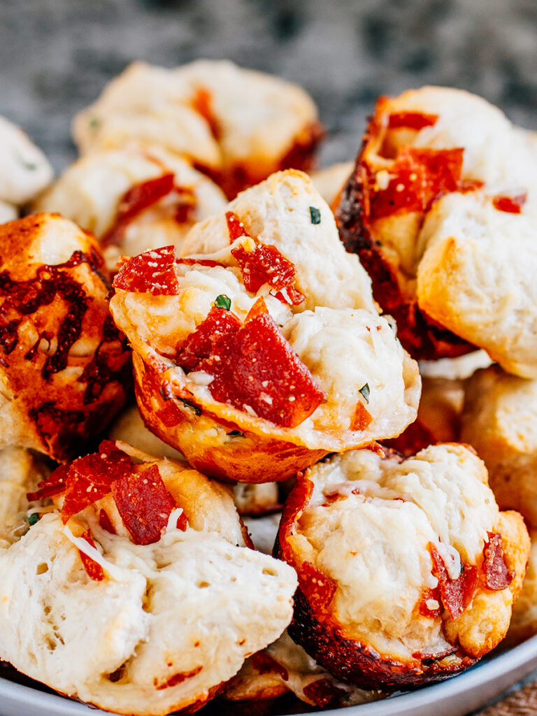 A pile of pull apart pizza muffins. A perfect appetizer.