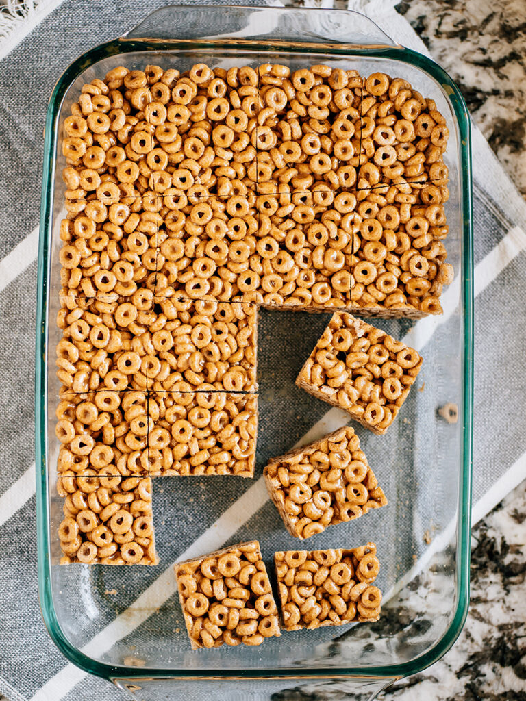 Peanut Butter Cheerio Bars in a baking sih and cut to be served.