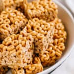 A close up these delicious chewy peanut butter cheerio bars in a serving dish.