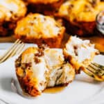 A close up of a pull apart sausage breakfast muffin covered in pancake syrup. They are sweet, light and fluffy with a good protein and cheese: A great breakfast for busy kids!