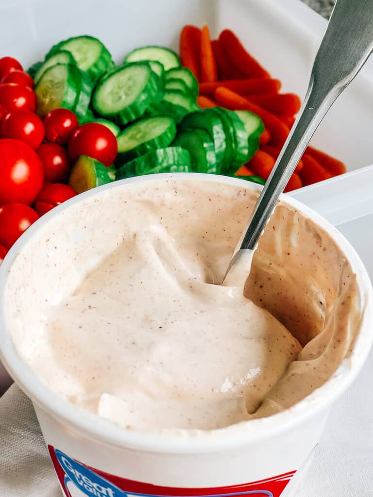 This chip dip can double as a great vegetable dip. Here the potato chip dip is with cherry tomatoes, mini cucumbers, and baby carrots.