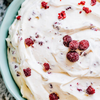 Easy raspberry fluff made with only four ingredients ready to be served: vanilla yogurt, instant vanilla pudding, cool whip, and frozen raspberries.