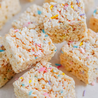 Rice Krispies Treats with unicorn sprinkles mixed in cut up and on a small pile.