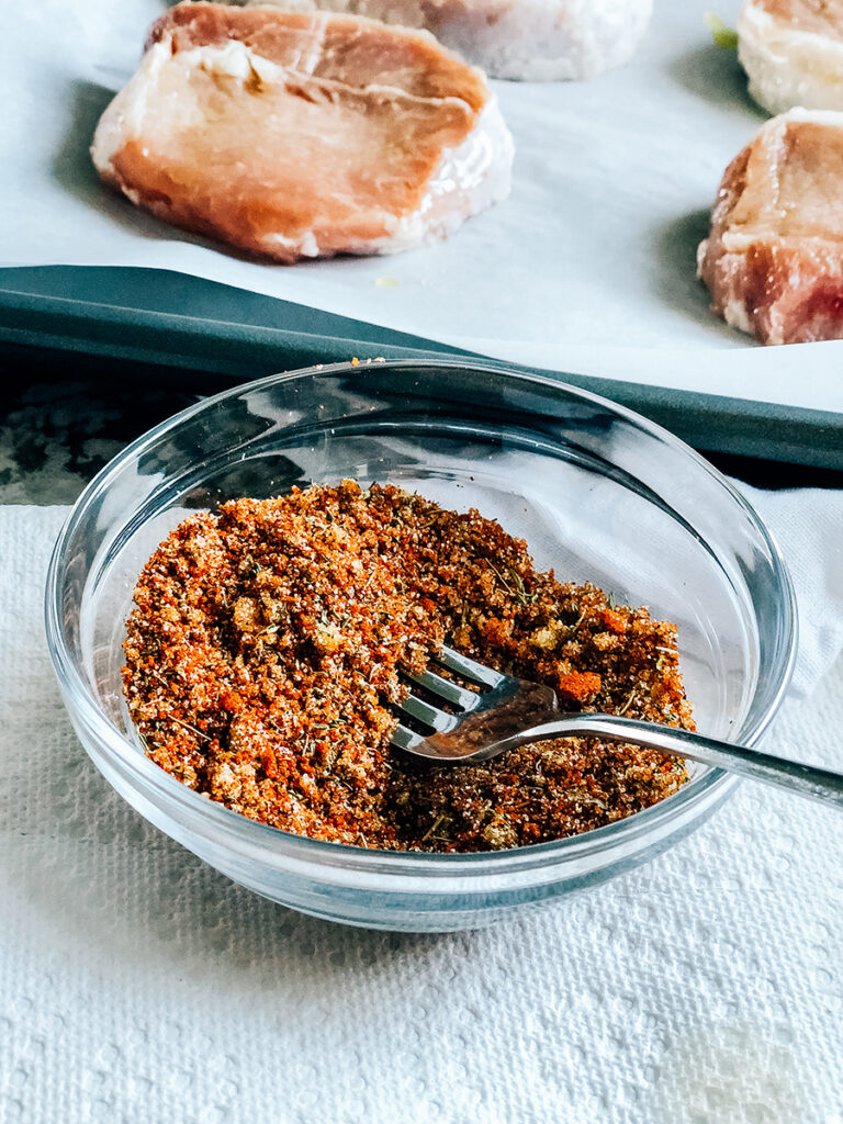 The stir bowl of spices and brown sugar for these delicious oven-baked pork chops.
