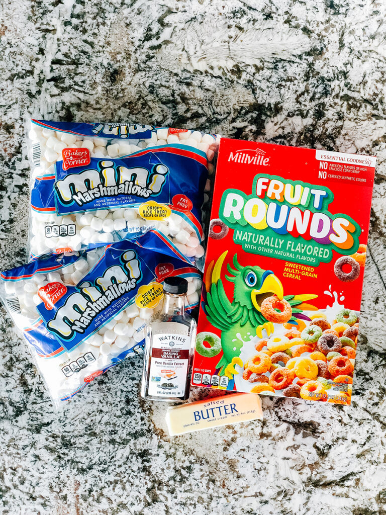 The ingredients to froot loops cereal treats: mini marshmallows, butter, vanilla and froot loops or off-brand fruit rounds.