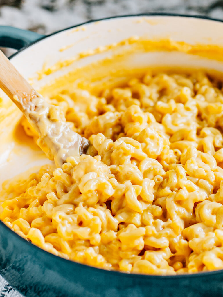 Creamy cheese sauce and perfectly cooked elbow macaroni make up this amazing homemade mac and cheese recipe.