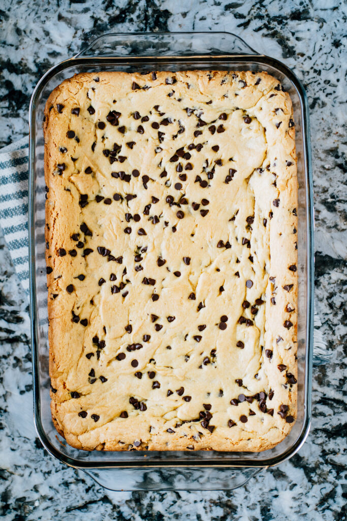 An overview shot of lazy chocolate chip cookie bars with mini chocolate chips.