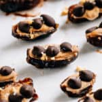 A tray of Medjool dates that taste like snickers are these delightful frozen treats.