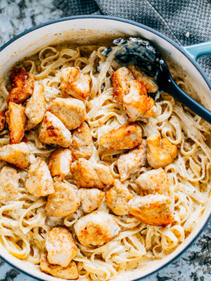 Tender seasoned chicken and fettuccine noodles covered in a thick homemade alfredo sauce make this the best creamy chicken alfredo!