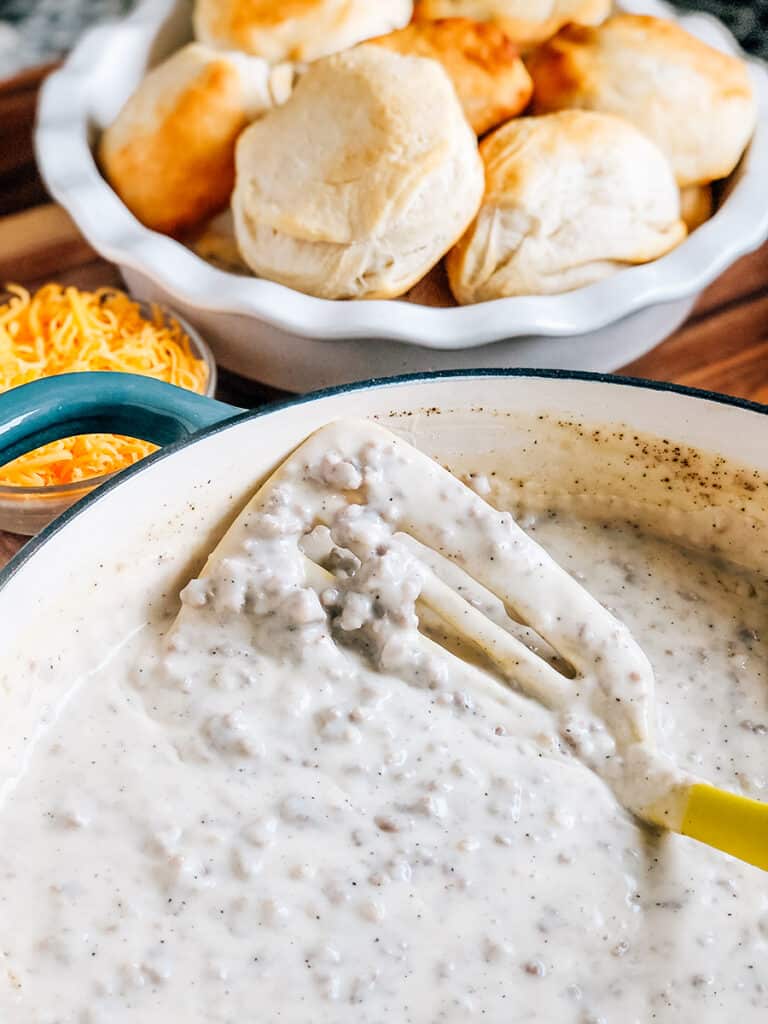 Homemade easy sausage gravy with fresly baked biscuits for a hearty family breakfast!