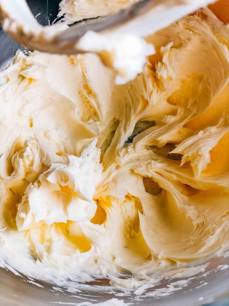 Creamed butter in a stand mixer.