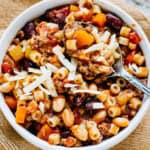 A bowl of hearty beef, tender beans, colorful vegetables, and ditalini pasta soup: Pasta E Fagioli soup!