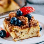 A serving of French Toast Casserole with fresh berries on top.