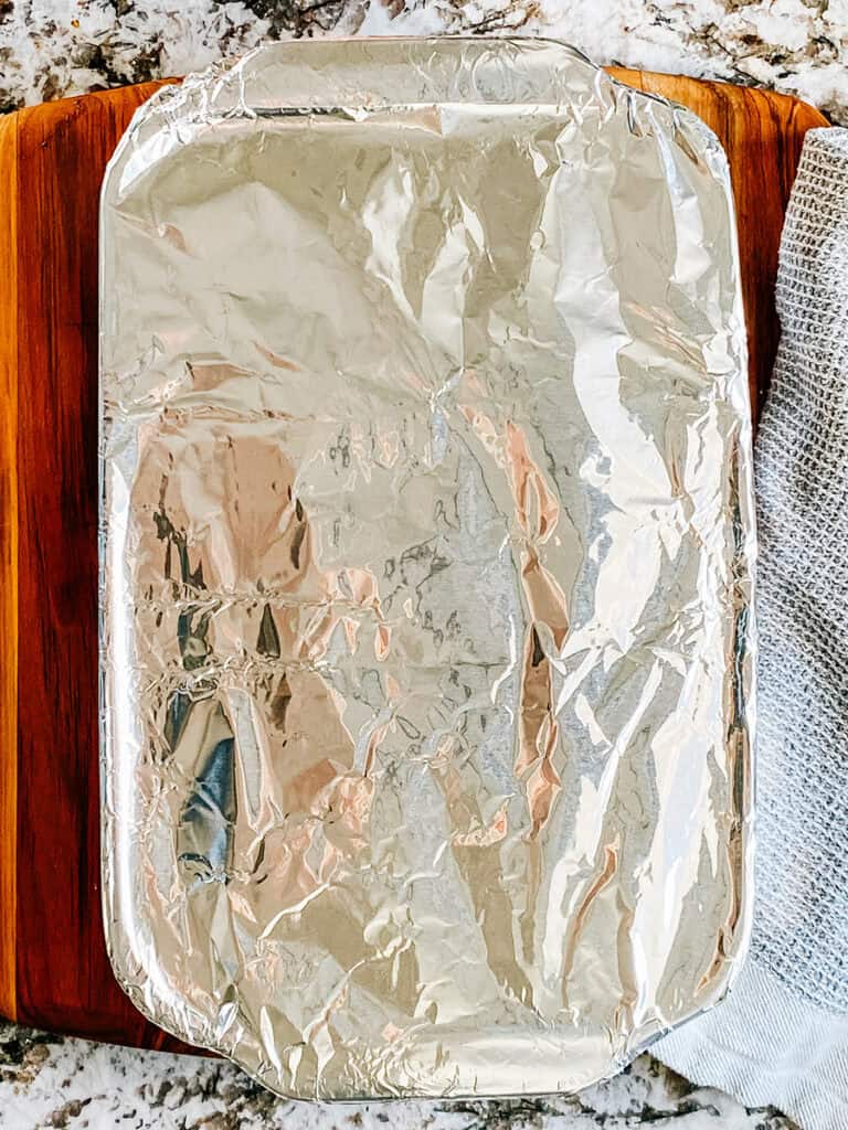9x13 in baking dish tightly covered with foil and ready to be baked.