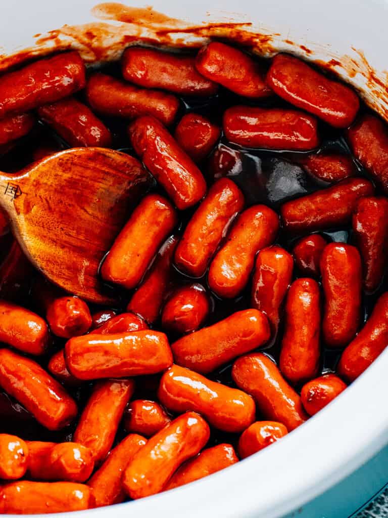 BBQ sauce and ketchup covered little smokies cooked to perfection for a delicious party appetizer.