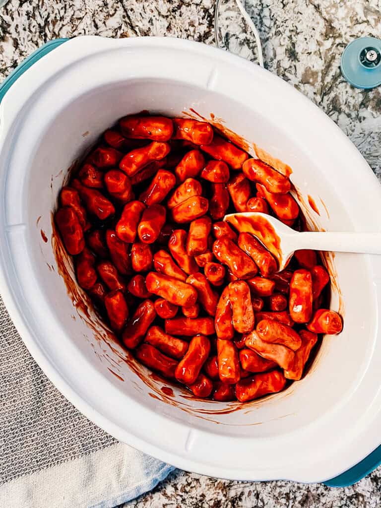 The little smokies coated in bbq sauce and ready to heat through.