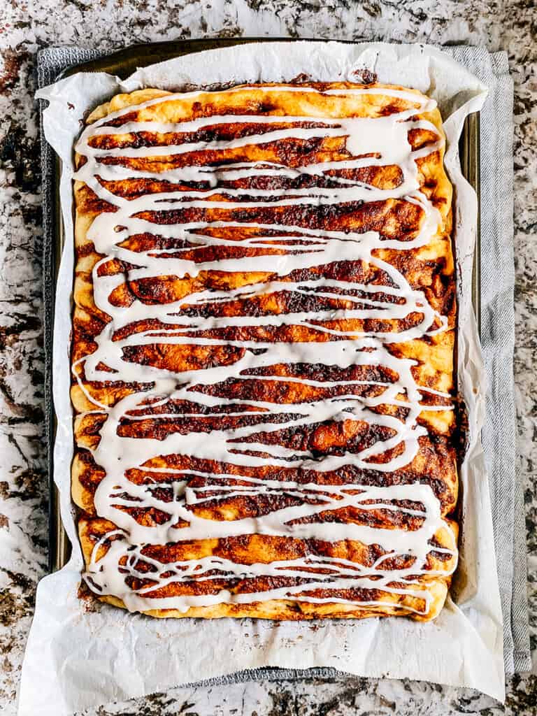 The glazed drizzled on top of the delicious cinnamon sugar focaccia bread.