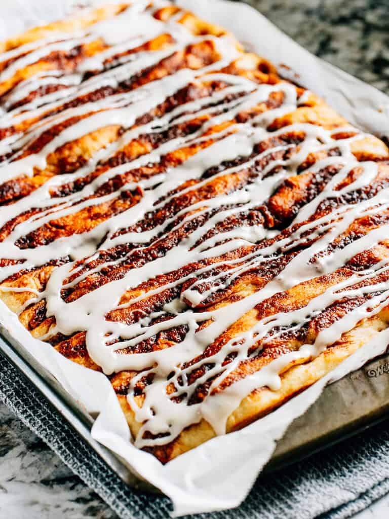 Side view of the pan of cinnamon swirled focaccia bread.