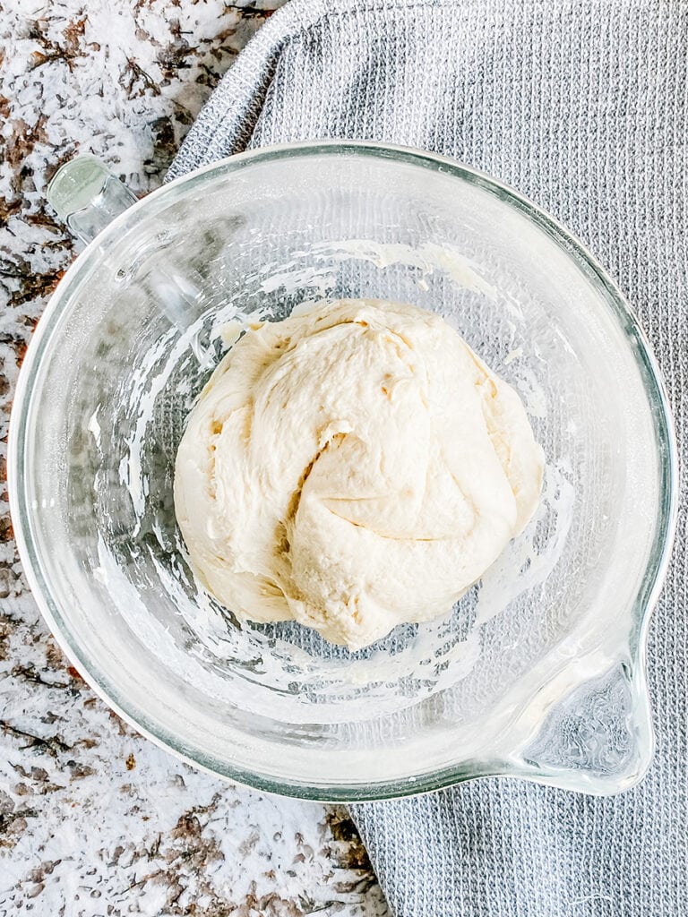 The completed focaccia bread dough in a ball in the stand mixer.