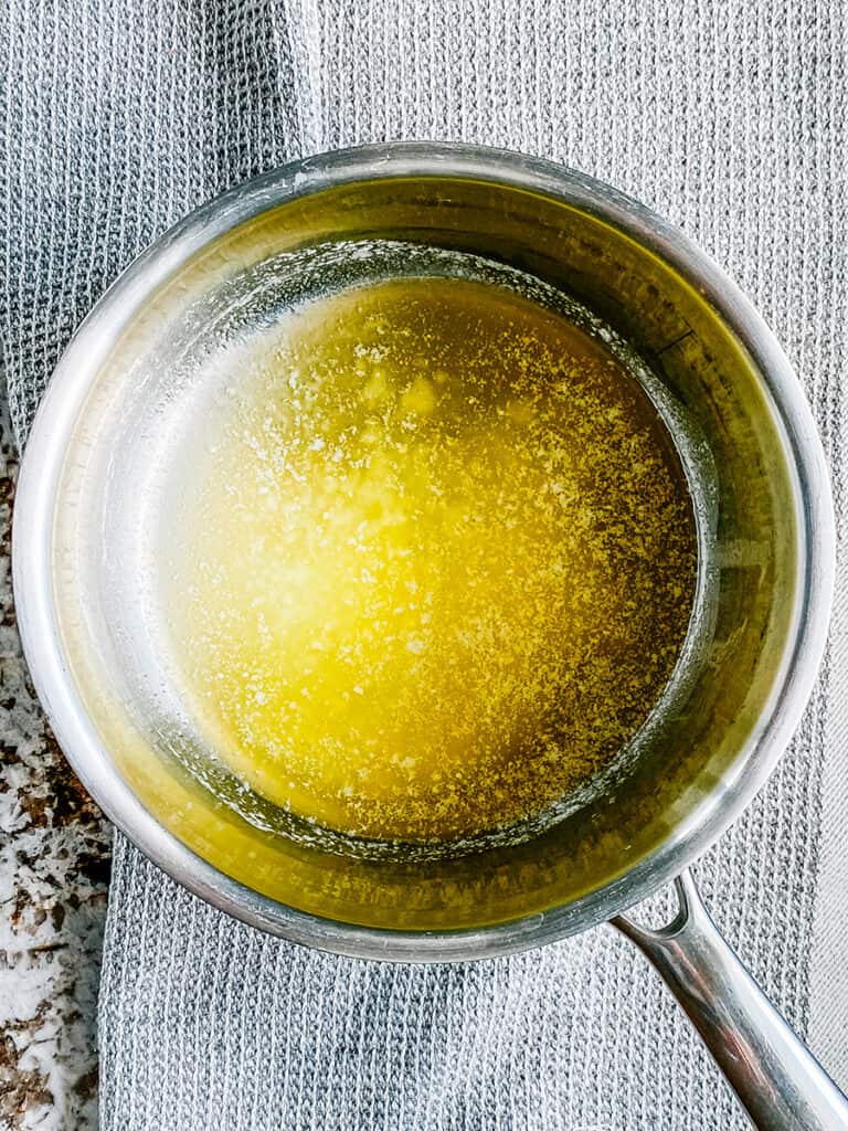 Melted butter in a saucepan.