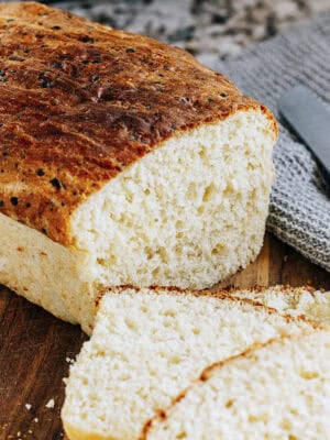 A close up showing the sliced end of a cottage cheese bread loaf.
