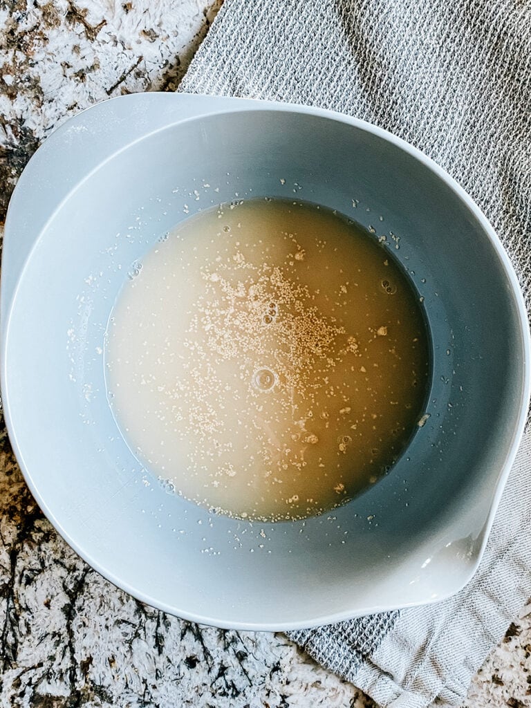 The sugar and yeast light dissolved into the warm water.