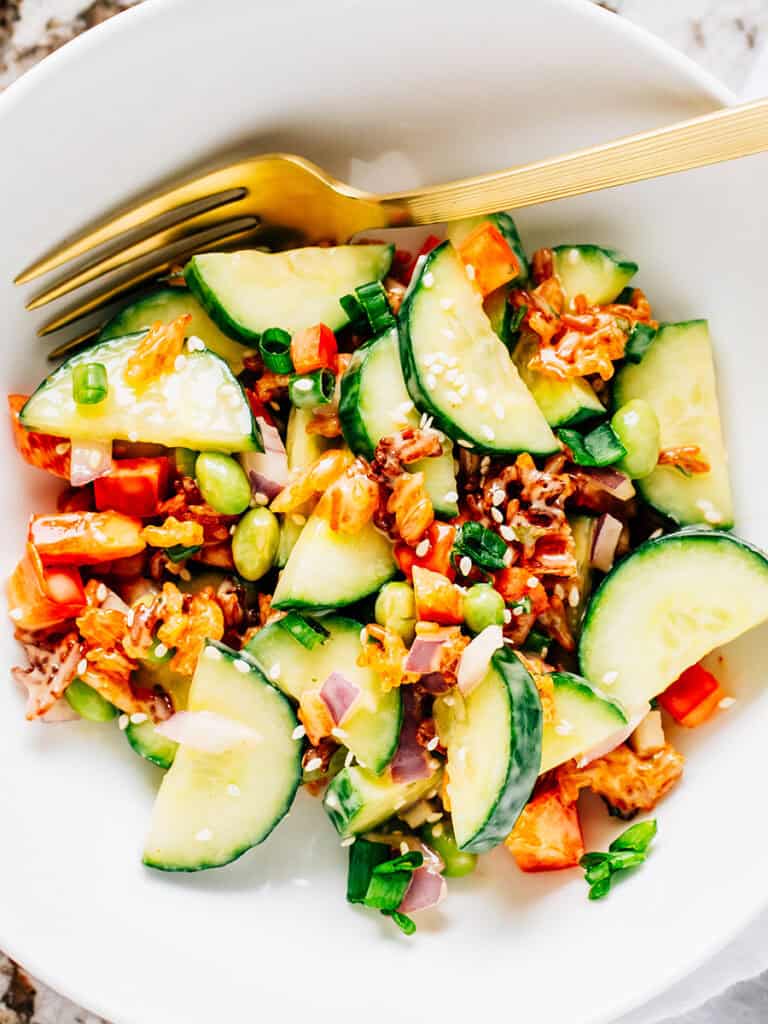Cucumbers, peppers, and crispy rice with a spicy mayo make this salad full of texture an flavor!