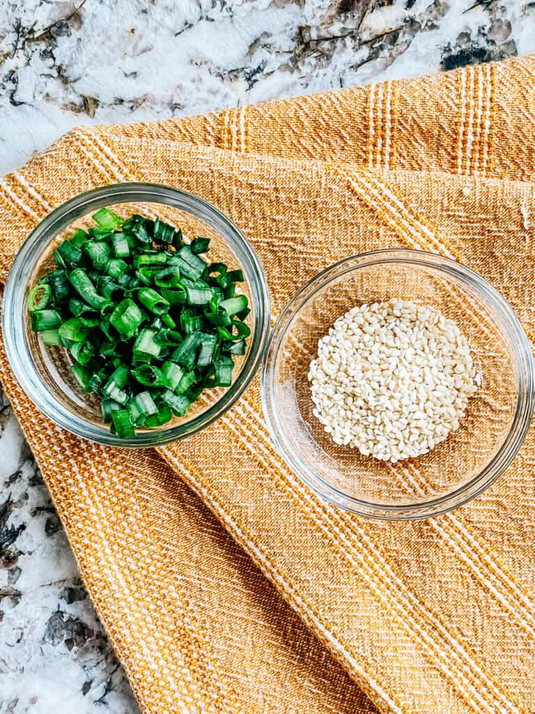 Crispy Rice Salad toppings: diced green onions and white sesame seeds.