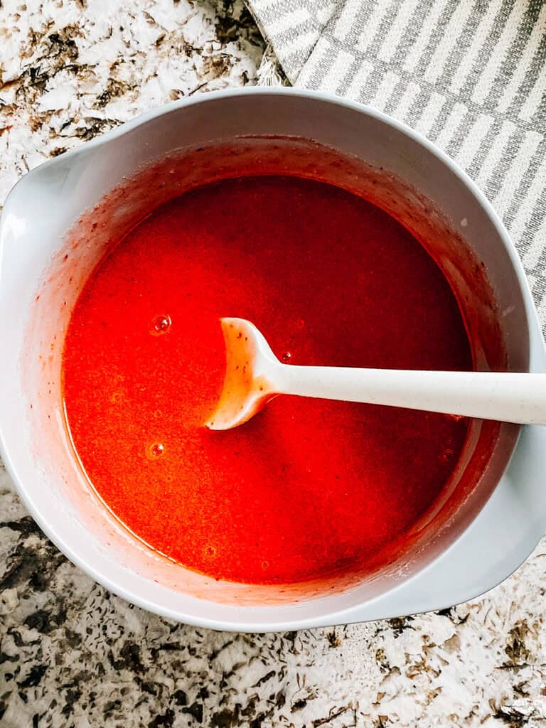 Whisked pectin, sugar, and strawberries.