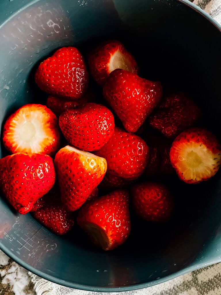 Stems removed and washed fresh strawberries.