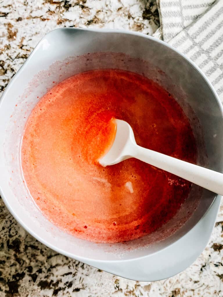 The prepared pectin poured into the sugared blended strawberries.