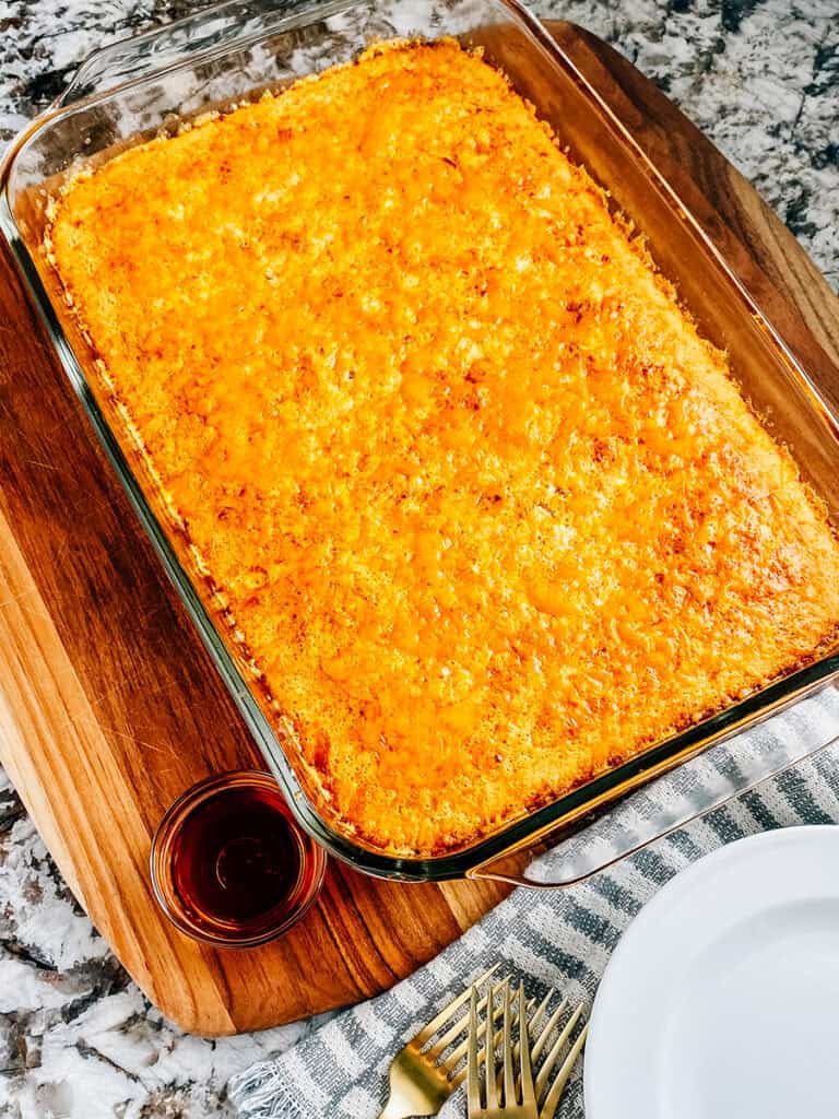 Ready to serve McGriddle Inspired Breakfast Casserole with plate and forks by it.